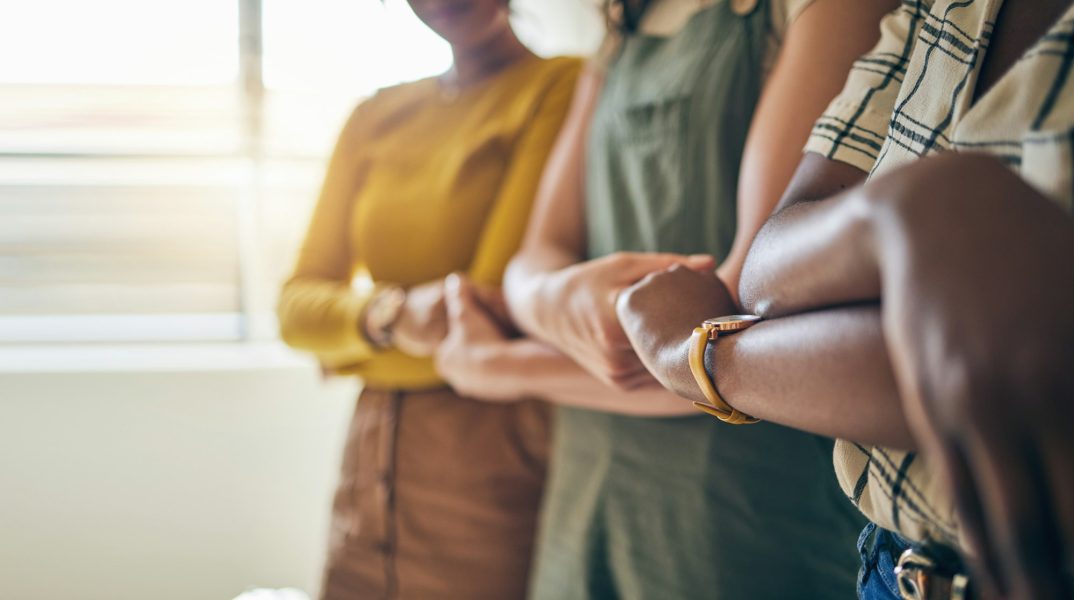 Holding hands, arms crossed and unity with business women in a row for equality or empowerment. Sup